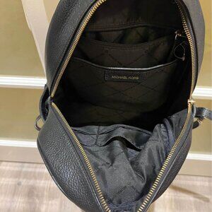 Michael Kors black leather backpack, used but in good conditions
